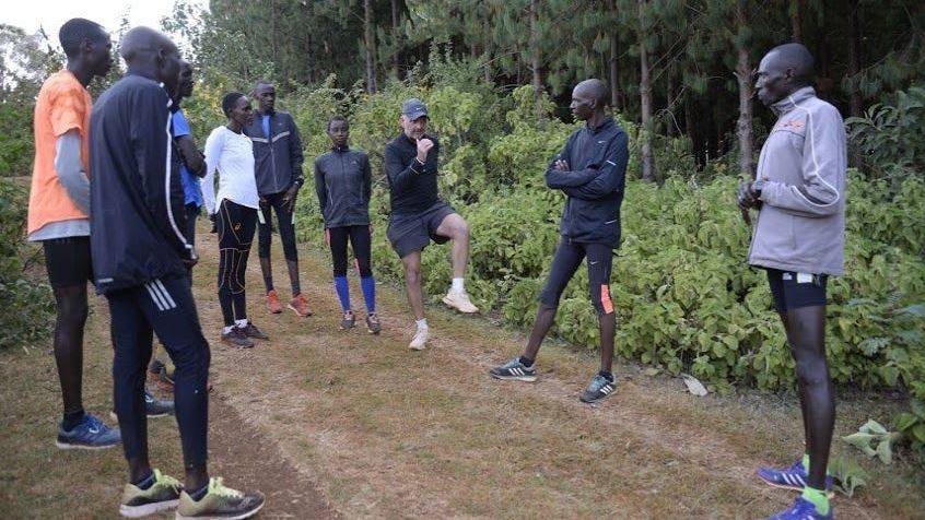 Coach Stazza coaching athletes in the forest at Iten, Kenya